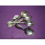 A matched set of six silver teaspoons having moulded decoration to stems and terminals, three having