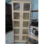 A modern beech effect display cabinet