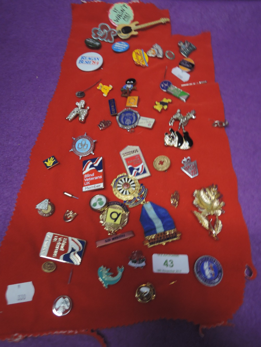 A selection of enamel pin badges and buttons