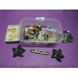A small selection of costume jewellery including brooches, earrings etc