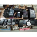 A selection of mobile phones sat nav and similar electronic items including Iphone