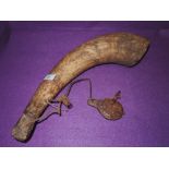 An early colonial or similar flint lock gun powder flask animal horn and wood with hide strap