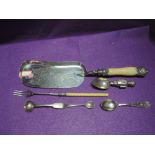 Three HM silver spoons including Victorian mustard spoon and an Edwardian Welsh shooting spoon, a