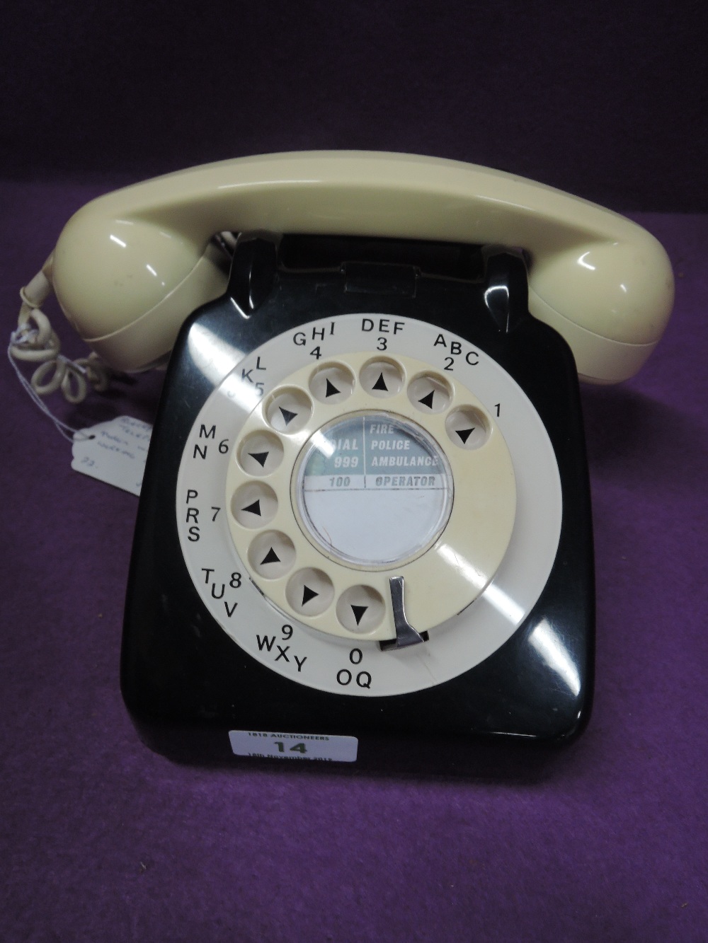 A mid century black and white two tone plastic telephone