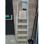 A set of metal and wooden step ladders