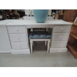 A modern painted dressing table and stool