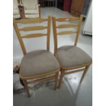 A pair of beech kitchen chairs