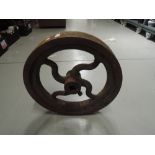A heavy cast iron industrial pulley wheel