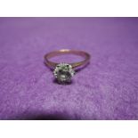A lady's dress ring having a cubic zirconia solitaire on a 9ct gold loop, size T