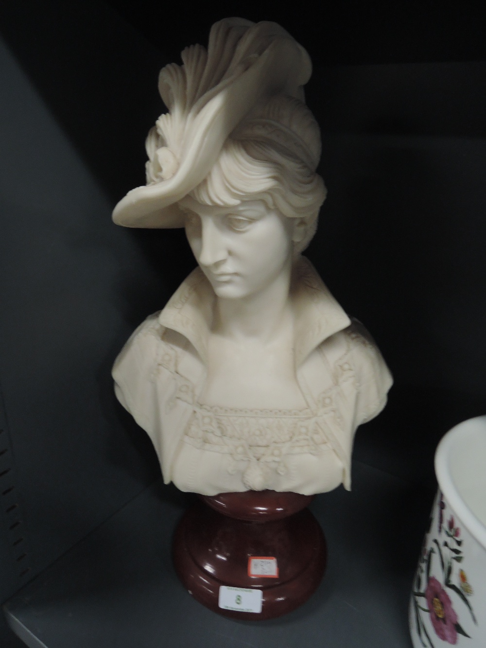 A cast figural female bust in regency dress