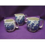 A set of graduated blue and white jugs by Sadler