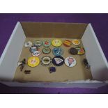 A selection of collectable enamel and pin badges