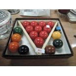 A selection of small size snooker balls and book