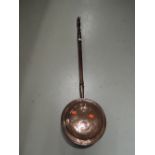 A copper bodied bed warming pan