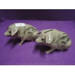 Two ceramic salt glazed pig or money banks dated 1935 both have age relate wear