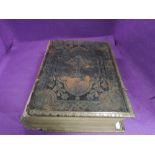 A large leather bound family bible by Rev Haydock