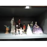 A selection of figures and figurines including Royal Doulton ladies