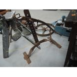 A vintage cast iron cart jack