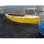 A 10' sailing dinghy with trailer