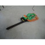 A power base electric hedge trimmer