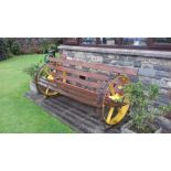 A garden chair built on the axle of a vintage finger mower. The item is sold in situ and can be