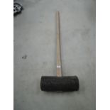 A large rubber post mallet