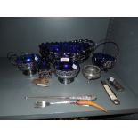 A selection of blue glass table wares and pocket knives