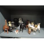 A selection of figures and figurines including Beswick black labrador