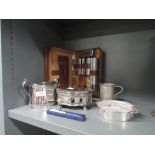 A selection of plated wares and similar brush set