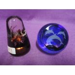 Two colour glass paper weights by Caithness