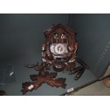 A wooden carved cuckoo clock