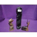 A selection of hand carved African figures including totem head