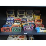 A shelf of mixed diecasts including Matchbox Models of Yesteryear, Corgi Classics, Burago and