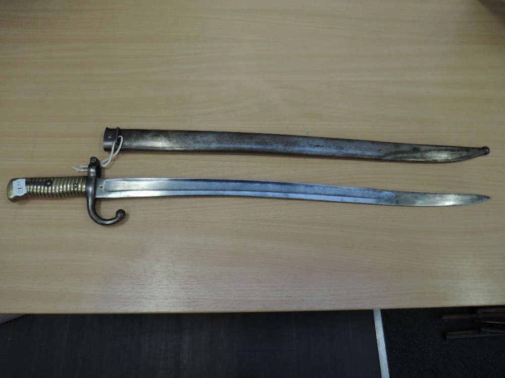 A French sword bayonet 1866 for The Chassepot Rifle with metal scabbard, in good condition
