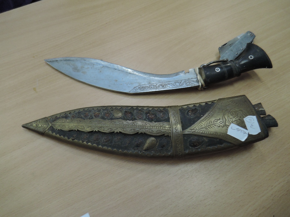 A Kukri knife with decorated blade and scabbard plus a British military knife