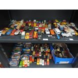 Two shelves of Matchbox and similar playworn diecasts, some in original boxes along with flatpack