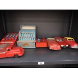 Two 1950's Mettoy and similar friction driven saloon cars, two plastic trucks, a 1970's Saab 800