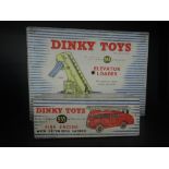 Two Dinky Toys diecasts, Fire Engine 955 and Elevator Loader 564, both in original blue and white