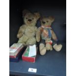 A mid 20th century teddy bear having stitched nose and mouth, plastic eyes and jointed body, a