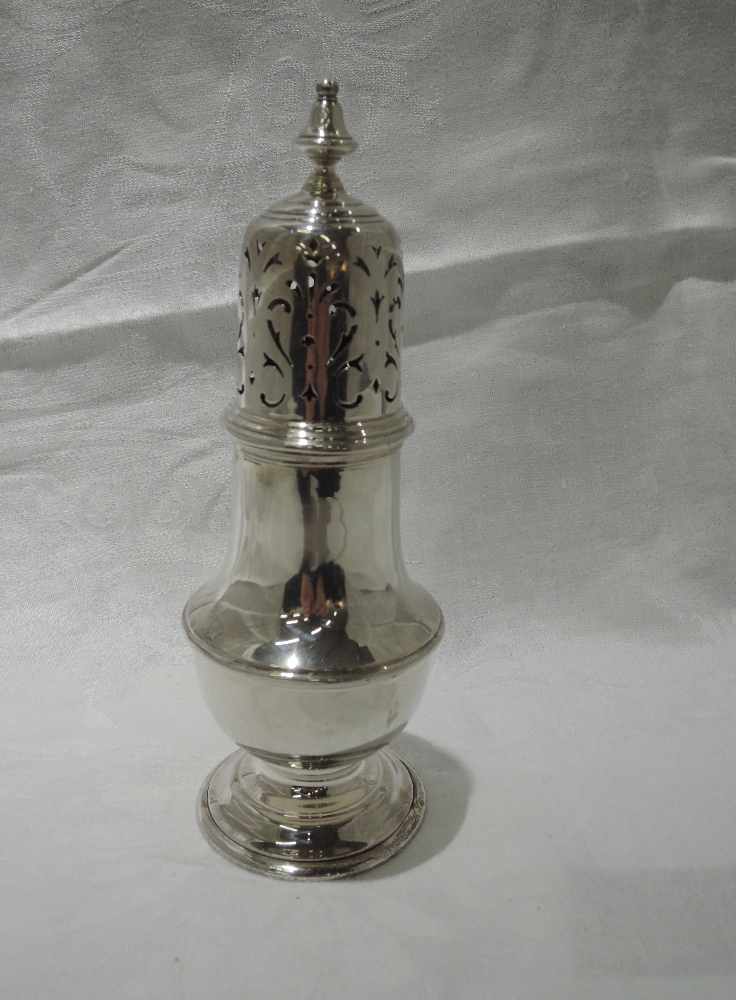 A silver sugar caster of waisted baluster form having pierced decoration to push on lid, London