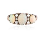 AN OPAL AND DIAMOND RING, set with three oval cabouchon stones between rose-cut diamonds with