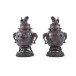 A PAIR OF JAPANESE BRONZE KORO AND COVERS, each of globular form, the cover surmounted by Kylins,