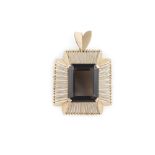 A SMOKY QUARTZ AND GOLD PENDANT CIRCA 1960s, the large cut-cornered step-cut smoky quartz, within