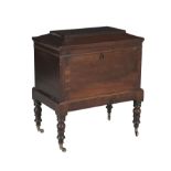 A 19TH CENTURY MAHOGANY RECTANGULAR CELLARETTE, with flat domed lid opening to reveal a