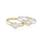 A PAIR OF DIAMOND RINGS, each collet-set round brilliant-cut diamond weighing approximately 0.