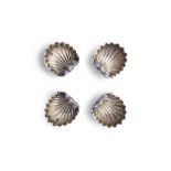 A SET OF FOUR VICTORIAN SILVER OPEN SALT CELLARS IN THE FORM OF SCALLOP SHELLS, London c.1863,