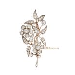 A LATE 19TH CENTURY FLOWER BROOCH, designed as a flowering branch with two six-stone florettes and