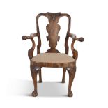 A GEORGIAN REVIVAL CARVED MAHOGANY ARMCHAIR, 19th Century, with vase shaped splat, outscrolling arms