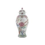 A DECORATIVE FAMILLE ROSE BALUSTER VASE AND COVER, painted and enamelled with peonies, birds,