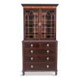 A GEORGE III MAHOGANY BOOKCASE, with arched lance glazed doors and shelved interior, above a chest